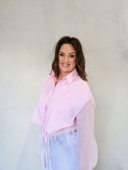 Lisa Bondarenko in a pink shirt.